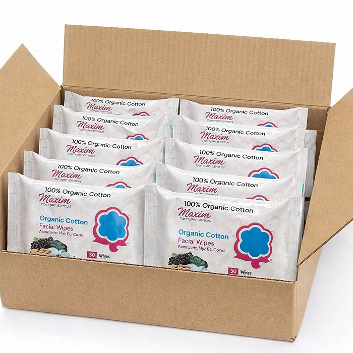 Cardboard display case holding six packs of Maxim Leak Proof Extra Protection Pads (Super), with three black boxes visible in front labeled ‘16 Super’ and ‘New and Improved,’ on a white background.
