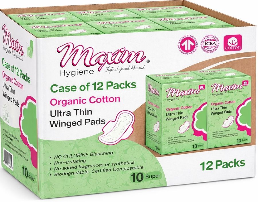 Case of 12 packs of Maxim Organic Cotton Ultra Thin Winged Pads (10 super per box), green packaging with chlorine-free, non-irritating, fragrance-free, biodegradable claims, and individual boxes displayed on the carton.