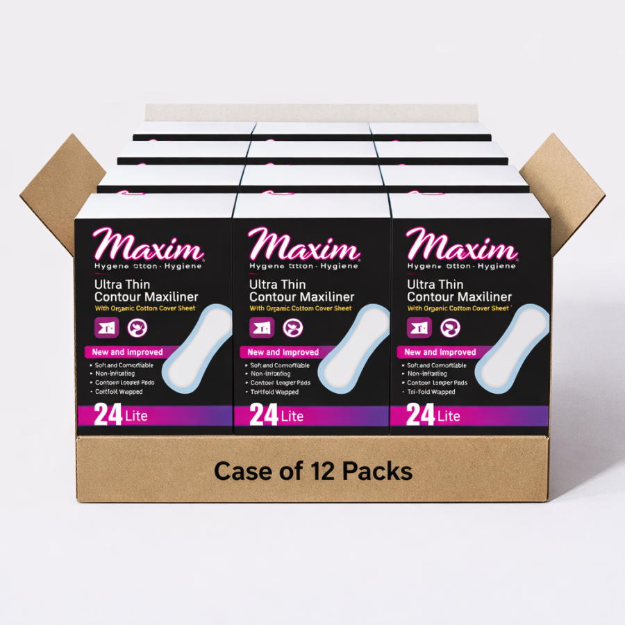 Open cardboard shipping tray labeled ‘Case of 12 Packs’ holding twelve Maxim Ultra Thin Contour Maxiliner boxes. The boxes are black with pink ‘Maxim’ logo, a white liner illustration, and a purple ‘24 Lite’ label along the bottom. The cartons are arrange