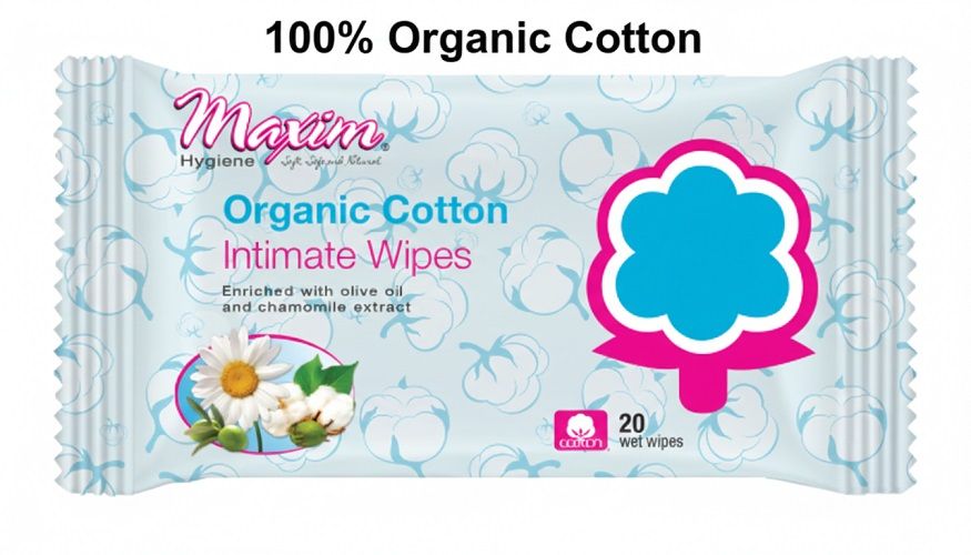 Front of a Maxim Organic Cotton Intimate Wipes packet with a blue cotton-pattern background, ‘100% Organic Cotton’ headline, flower-and-cotton illustration, and ‘20 wet wipes’ label.